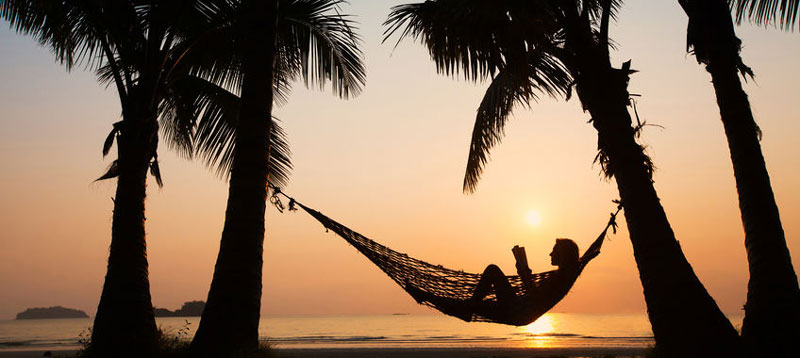 Relaxing in hammock on beach